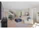 Spacious living room with an open staircase, hardwood floors, and comfortable seating at 1719 Shoreham Dr, Charlotte, NC 28211
