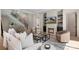 Inviting living room features fireplace, and views of the backyard and staircase at 1719 Shoreham Dr, Charlotte, NC 28211