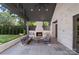 Inviting outdoor living space with a fireplace and cozy seating, ideal for entertaining at 1719 Shoreham Dr, Charlotte, NC 28211