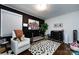 Well-decorated Bedroom features a crib, white chair, and a dark accent wall for a comforting and stylish design at 1816 Anderson St, Charlotte, NC 28205