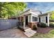 Attractive front exterior with brick accents, stylish siding, welcoming porch, and landscaped yard at 1816 Anderson St, Charlotte, NC 28205