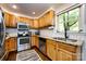 Efficient kitchen with stainless steel appliances, bright cabinets, and a convenient layout for cooking at 1816 Anderson St, Charlotte, NC 28205