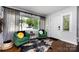 Bright, inviting living room with hardwood floors, large window, and stylish décor at 1816 Anderson St, Charlotte, NC 28205