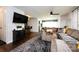 Spacious living room boasting a large sectional, view of the bar, and easy access to the dining area at 1816 Anderson St, Charlotte, NC 28205