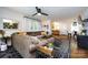Bright living room with a decorative mirror, cozy sectional sofa, and view to the kitchen and dining area at 1816 Anderson St, Charlotte, NC 28205