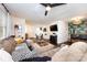 Comfortable living room with a large sectional, mounted TV, and stylish decor flowing into the dining space at 1816 Anderson St, Charlotte, NC 28205