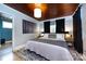 Serene main bedroom with soft lighting, neutral tones, and a decorative rug under the bed at 1816 Anderson St, Charlotte, NC 28205