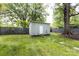 Backyard showing the storage shed, fence, and landscaping at 1816 Anderson St, Charlotte, NC 28205