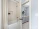 Stylish bathroom showcases tiled shower/tub and vanity with gray cabinets at 1816 Parson St, Charlotte, NC 28205