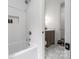 Bright bathroom featuring subway tile surround, marble floors, and a wood vanity at 1816 Parson St, Charlotte, NC 28205