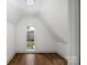 Attic bedroom features hardwood floors and a bright window at 1816 Parson St, Charlotte, NC 28205
