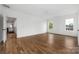 Bright, open bedroom featuring hardwood floors, large windows, and white walls at 1816 Parson St, Charlotte, NC 28205