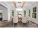 Elegant dining room featuring a large window, stylish lighting, and hardwood floors at 1816 Parson St, Charlotte, NC 28205