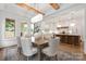 Well lit dining area flowing into kitchen featuring a seamless transition with hardwood floors at 1816 Parson St, Charlotte, NC 28205