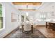 Open concept dining room with hardwood floors, exposed beams, and ample seating at 1816 Parson St, Charlotte, NC 28205