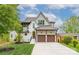 Beautiful two-story home boasting a manicured lawn, two-car garage, and charming architectural details at 1816 Parson St, Charlotte, NC 28205