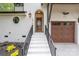 Charming front entrance with white brick, a wooden door, and a matching garage at 1816 Parson St, Charlotte, NC 28205