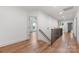 Hallway with wood floors, staircase and multiple access points to other rooms at 1816 Parson St, Charlotte, NC 28205