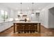 Gourmet kitchen featuring a large island, pendant lighting, and modern stainless steel appliances at 1816 Parson St, Charlotte, NC 28205