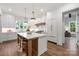 Modern kitchen featuring a large center island, pendant lighting, and white cabinetry at 1816 Parson St, Charlotte, NC 28205