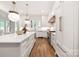 Bright kitchen showcasing a large island with seating, stainless steel appliances, and sleek cabinetry at 1816 Parson St, Charlotte, NC 28205