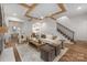 Spacious living room boasts hardwood floors, wooden ceiling beams, and a cozy fireplace at 1816 Parson St, Charlotte, NC 28205