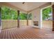 Covered outdoor patio with a wood-burning fireplace and fenced yard, great for entertaining at 1816 Parson St, Charlotte, NC 28205