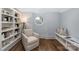 Cozy reading nook with built-in shelving, comfortable chair, and soft, natural light at 1816 Parson St, Charlotte, NC 28205