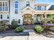 Gorgeous wood double door entrance with covered porch and manicured landscaping for enhanced curb appeal at 1900 Nassau Blvd, Charlotte, NC 28205