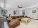 Comfortable living room showcasing a brown leather couch, desk and built in shelves at 1900 Nassau Blvd, Charlotte, NC 28205