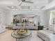 Bright living room features coffered ceilings, neutral tones, and open floor plan with views of the kitchen at 1900 Nassau Blvd, Charlotte, NC 28205