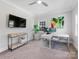 Bright home office with neutral walls, carpet, ceiling fan, and a window for natural light at 1900 Nassau Blvd, Charlotte, NC 28205