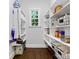 Well-organized pantry with ample shelving, storage baskets, and natural light from the window at 1900 Nassau Blvd, Charlotte, NC 28205