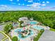 Stunning aerial view of the community pool and recreation center with multiple pools, slides, and lounge areas at 2007 Lydney Cir, Waxhaw, NC 28173