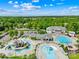 Beautiful aerial view of the community pool and recreation area surrounded by lush trees and ample amenities at 2007 Lydney Cir, Waxhaw, NC 28173
