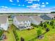 Aerial view of homes showcasing backyard, landscaping, screened-in porch, and neighborhood at 2007 Lydney Cir, Waxhaw, NC 28173