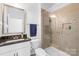 Bright bathroom features a walk-in shower, vanity, and granite countertops at 2007 Lydney Cir, Waxhaw, NC 28173