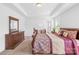 Spacious bedroom with tray ceilings, carpet floors, and natural light at 2007 Lydney Cir, Waxhaw, NC 28173