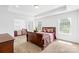 Spacious bedroom with tray ceilings, carpet floors, and natural light at 2007 Lydney Cir, Waxhaw, NC 28173
