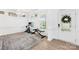 Bright exercise room featuring natural light, hard wood floors, and modern workout equipment at 2007 Lydney Cir, Waxhaw, NC 28173
