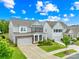 Attractive two-story home with a brick facade, well-maintained lawn, and a two-car garage at 2007 Lydney Cir, Waxhaw, NC 28173