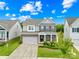 Charming two-story home with brick accents, well-manicured lawn, and attached two-car garage at 2007 Lydney Cir, Waxhaw, NC 28173