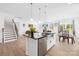 Open kitchen with a large island, stainless steel appliances, and access to the dining room at 2007 Lydney Cir, Waxhaw, NC 28173