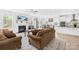 Open-concept living room and kitchen area with lots of natural light and modern fixtures at 2007 Lydney Cir, Waxhaw, NC 28173