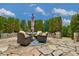 Inviting back patio with stone pavers, stylish seating and lush landscaping provides a private outdoor space at 2106 Yellowstone Dr, Fort Mill, SC 29707