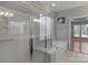This bathroom features a glass shower, soaking tub, tile floors, and plenty of light at 2106 Yellowstone Dr, Fort Mill, SC 29707