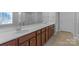 Bathroom features dual sinks, spacious countertop with cabinets, and a large mirror at 2106 Yellowstone Dr, Fort Mill, SC 29707