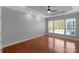 Spacious bedroom boasts tray ceiling, fan, hardwood floors, and three windows for ample natural light at 2106 Yellowstone Dr, Fort Mill, SC 29707