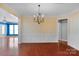 Spacious dining room with hardwood floors, decorative chandelier, and ample natural light perfect for entertaining at 2106 Yellowstone Dr, Fort Mill, SC 29707