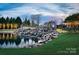 Scenic entrance to Sun City Carolina featuring a waterfall and beautiful landscaping at 2106 Yellowstone Dr, Fort Mill, SC 29707